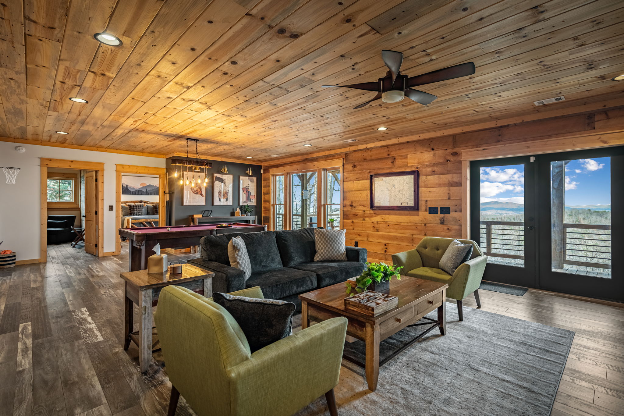 Game room seating area with mountain views