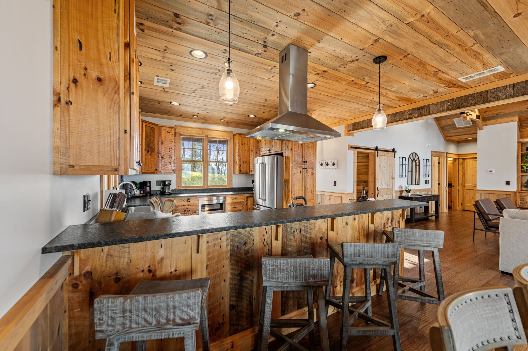 Kitchen island with bar seating and pendant lights