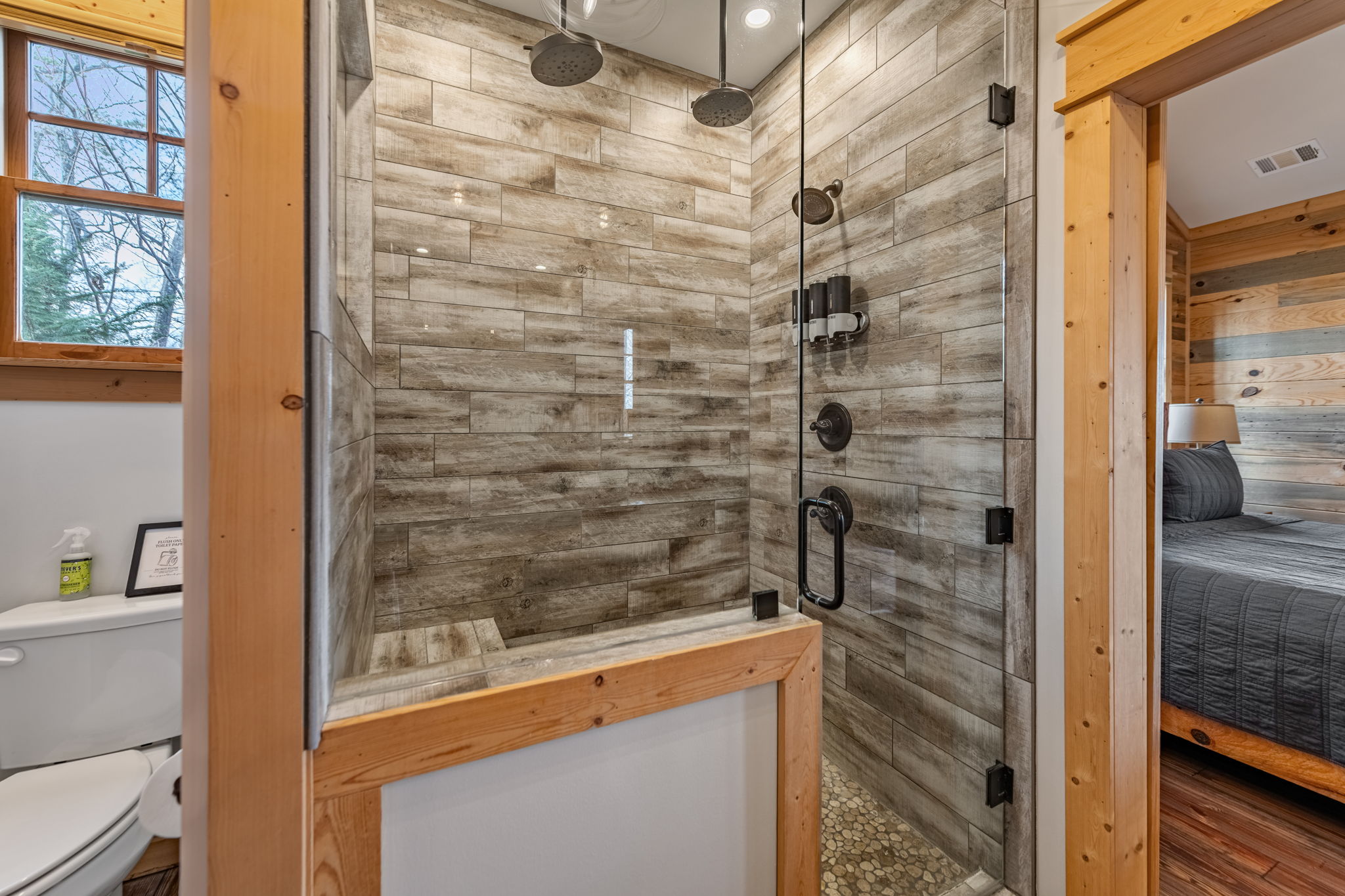 Spa shower with dual rain heads at luxury mountain cabin rental Blue Ridge GA